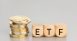 Cryptocurrency ETF concept. Stacked crypto coins and wooden blocks with text. Copy space
